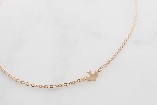 Gold Bird Necklace by dav store